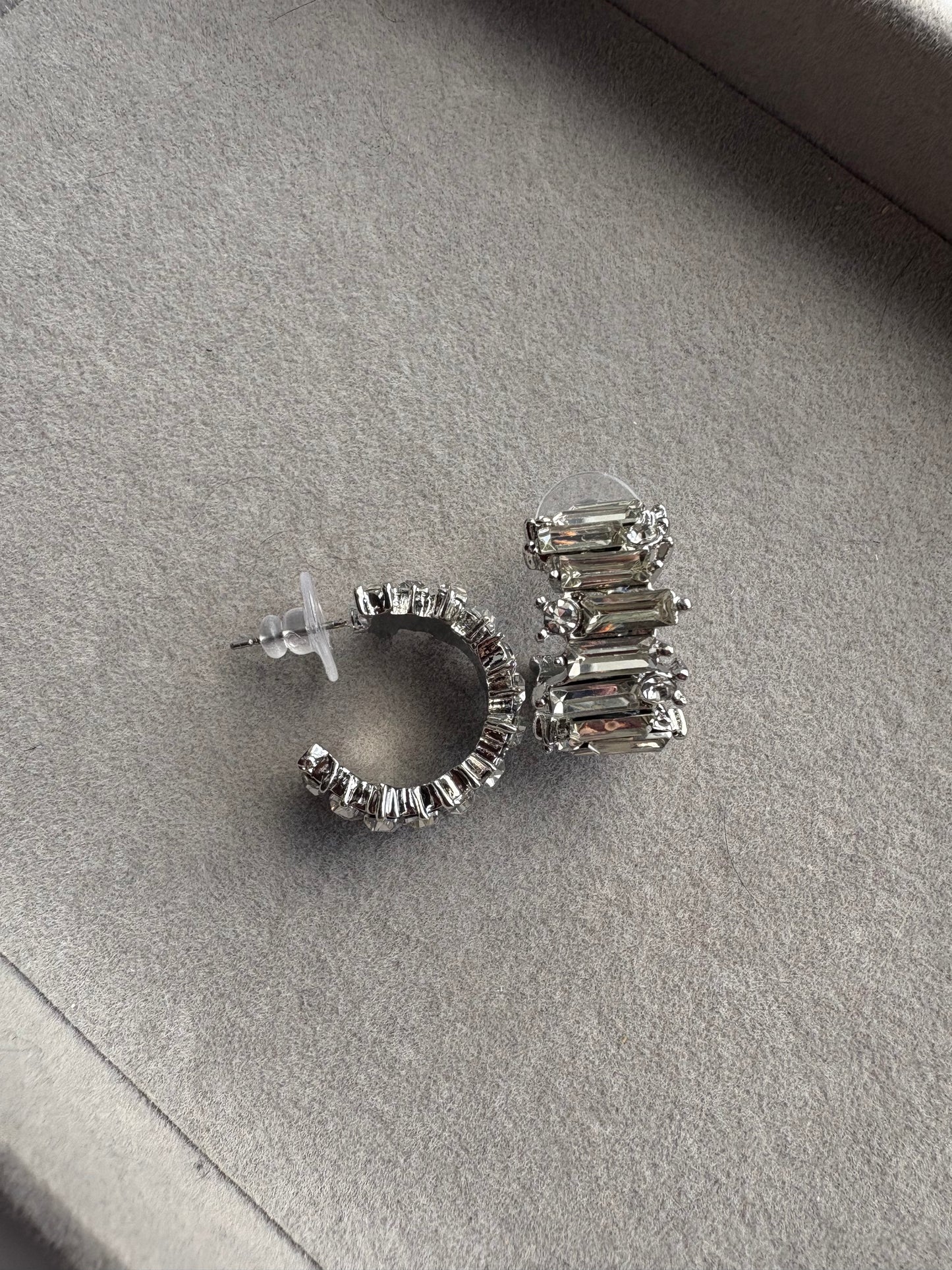 Curved silver diamond hoops