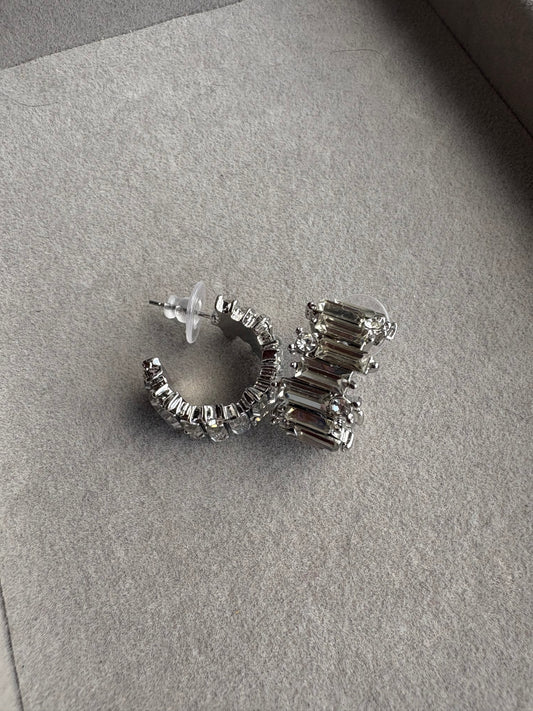 Curved silver diamond hoops