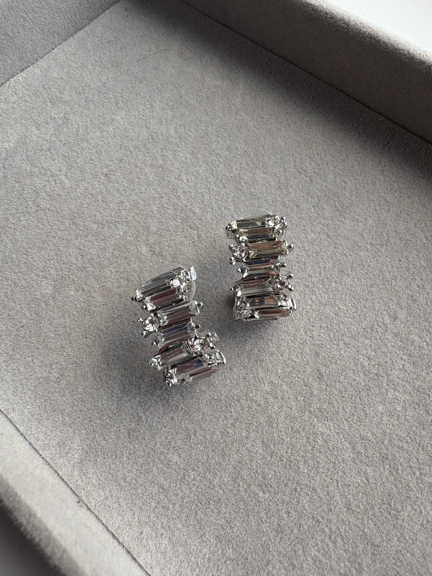 Curved silver diamond hoops
