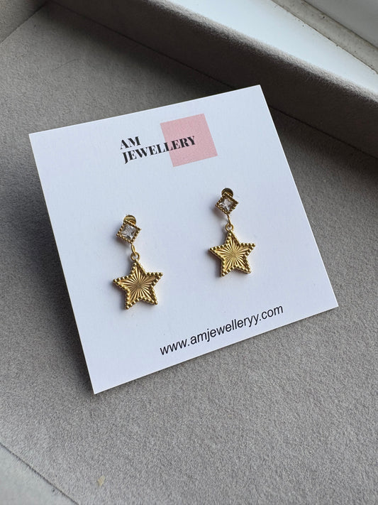 Gold star earrings