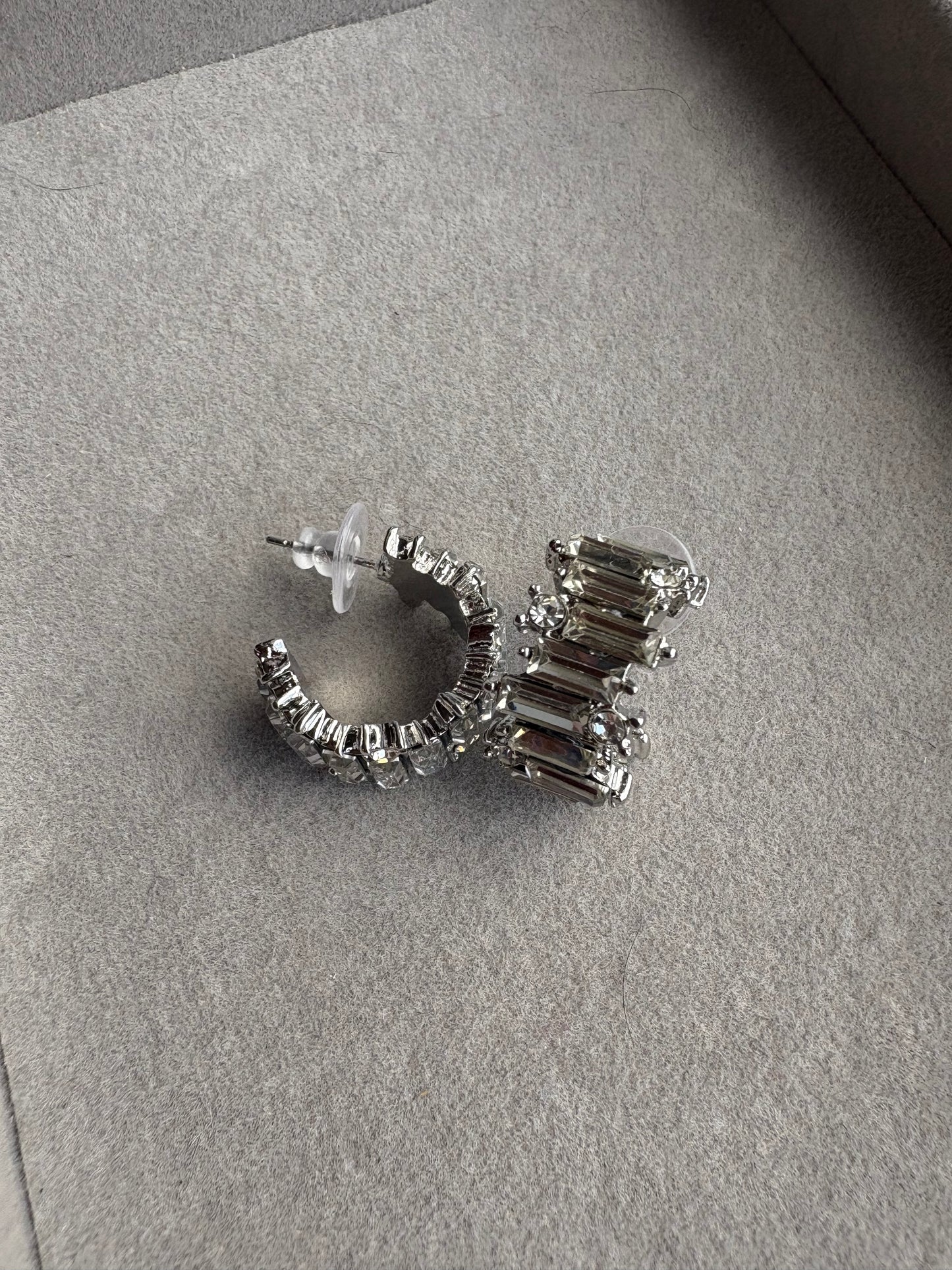 Curved silver diamond hoops